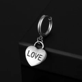 Macro view of vintage silver steel hoop earring with engraved LOVE heart pendant - Letter Heart