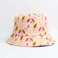 Close-up of pink bucket hat featuring tropical banana, papaya, and lychee fruit prints - One Size / Pink