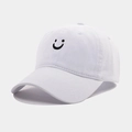 Vintage washed white baseball cap with black embroidered smiley face and curved brim - Adjustable / White