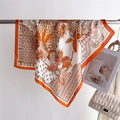 Close-up of silk printed scarf with leopard pattern and palm leaves on a metal rack - 66-70CM / Orange Red