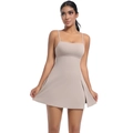 Close-up of a beige tennis dress with thin straps and a side slit on the skirt hem - Bark