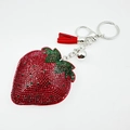 Red strawberry rhinestone keychain with leather tassel and silver bell on white background - Wine Red with Dark Green