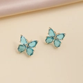 Close-up of blue crystal butterfly earrings on elegant beige silk fabric background - 11# Lake Blue Stud Earrings