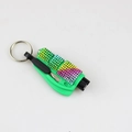 Detail of green emergency car tool with colorful rhinestones on a white background - Green Stripe