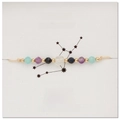 Detail of Virgo zodiac beaded bracelet with natural sapphire and amethyst on display card - Virgo