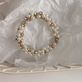 Detailed view of elastic hair tie featuring white pearls and sparkling rhinestones - Small Pearl Zirconia