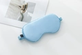 Light blue 22 momme mulberry silk sleep eye mask with elastic strap on white background - Light Blue