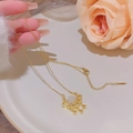 Collana in acciaio al titanio dorato con pendente serratura Ruyi e pietra occhio di gatto - Stile Ciondolo Lucchetto Ruyi con Nappa (X105) / Oro