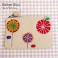 Handmade beige wool felt dandelion pouch with floral embroidery and pompom charm - Beige