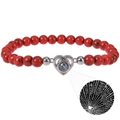 Macro detail of red stone beaded bracelet featuring a heart-shaped I Love You projection - Heart-Red Turquoise