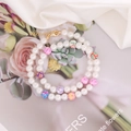 Detail of bohemian pearl necklace with colorful clay beads and golden lobster clasp closure - 7# Round Bead Style