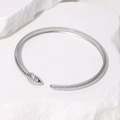 Minimalist silver snake-shaped open bracelet with detailed scales on white rock background - Bright Silver (SZ053-S)