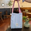 Vertical striped canvas tote bag in blue and purple with pink shoulder strap and logo - Blue Striped
