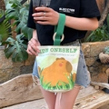 Canvas bucket bag featuring a cute capybara print and green webbing handle with wooden ring - Pride Capybara