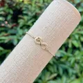 Detail of 18K gold plated infinity and heart bracelet with micro-pave cubic zirconia - Heart and Infinity Combination