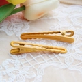 Detail of yellow wave-textured metal hair clips on romantic lace with tulip decoration - Sunflower Yellow