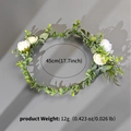 Dettaglio della fascia floreale con circonferenza di 45 cm e peso di 12 g indicati - Bianco e Verde