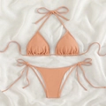 Chic pale peach pink two-piece bikini set with waffle texture and side-tie detailing - Coral Pink