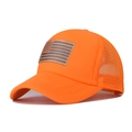 Close-up of bright orange trucker hat with US flag patch and breathable mesh back - Orange