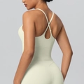 Creamy beige cross-back yoga set featuring a seamless sports bra and high-waist leggings - S / Light Ivory