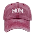 Close-up of vintage washed cotton baseball cap featuring white MOM embroidery and distressed texture - Washed MOM Wine Red