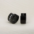 Macro shot of black stainless steel hinged hoop earrings with vertical zircon inlay - Black (KE109381-XY)