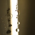 Golden moon and sun crystal suncatcher with prisms creating rainbow light reflections - Style 23