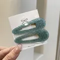 Sparkly mint green sequin drop hair clips on white card holder, pair of two pieces - Shimmering Teal