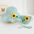 Close-up of mint blue summer straw hat and matching purse with sunflower detail - Hat And Crossbody Bag / Light Blue