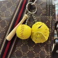 Detailed view of yellow baseball, glove, and wooden bat keychain on a designer bag - 3.5CM All Yellow