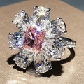 Elegant floral silver ring featuring a central pink square zircon and pear-shaped accents - Ur0670