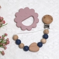 Pink lion silicone teether with blue beaded pacifier clip on a soft knit background - Lion Teether + Beaded Chain / Dark Blue
