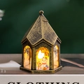 Detail of vintage Christmas LED lantern featuring painted snowman and reindeer design - Bronze - Snowman