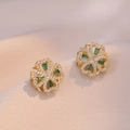 Golden clover earrings with micro-set zircons and emerald stones on silk fabric - Emerald Heart Earrings / Gold