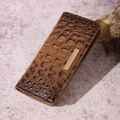 Brown crocodile pattern wallet with gold metal buckle on light purple background - Roman Brown
