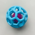 Hollow dog toy ball made of blue TPR rubber with a purple bell inside for pet play - Blue Ball-in-Ball
