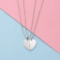 Polished stainless steel heart puzzle necklace set for couples on pink blue background - Silver Set