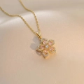Rotating pink flower pendant necklace in gold finish with sparkling crystals for women - Necklace / Pink Bauhinia (X1310)