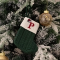Green knit Christmas stocking with white cuff and red embroidered letter P on snow branch - Green/Letter P