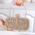 Luxurious gold evening clutch bag with white rhinestones and a metal top handle - Champagne