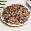 Polished natural red rutilated quartz crystal stones displayed in a white bowl - Black Gold Ultra (7-9mm) 100g