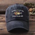 Close-up of fish embroidery and Women Want Me text on washed dark grey baseball cap - One Size / Black