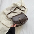 Dark brown retro saddle bag with gold buckle and flap design for winter fashion - Brown