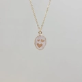 Golden stainless steel necklace featuring a pink resin pendant with three gold heart motifs - Rose Quartz-Heart