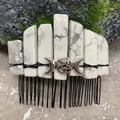 Detail of natural howlite crystals and silver triple moon goddess symbol on hair comb - White Turquoise Black Wire Silver Moon
