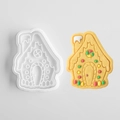 White gingerbread house plastic cookie mold with decorated sugar cookie sample - Christmas House