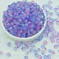 Detailed macro of 6mm purple and blue frosted glass beads with gold foil in a white bowl - 6mm Purple Blue Gradient