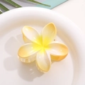Macro detail of Frangipani shark hair claw clip in yellow and white gradient finish - Yellow