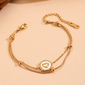 Detail of 18k gold plated double layer bracelet with white shell heart pendant and beads - Gold Double Layer Heart Bracelet (I114)