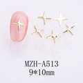 Détail des breloques à ongles en forme d'étoile dorée sur des ongles roses - Grande Étoile Brillante Dorée (A513)